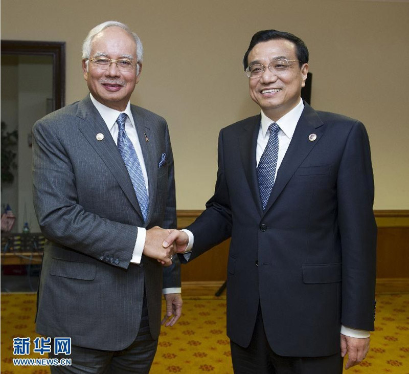 10月9日，國務院總理李克強在文萊斯裡巴加灣市會見馬來西亞總理納吉布。 新華社記者黃敬文攝