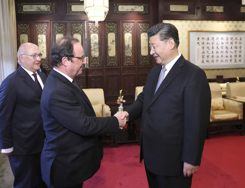 5月25日，國家主席習近平在北京釣魚台國賓館會見法國前總統奧朗德。新華社記者 龐興雷 攝