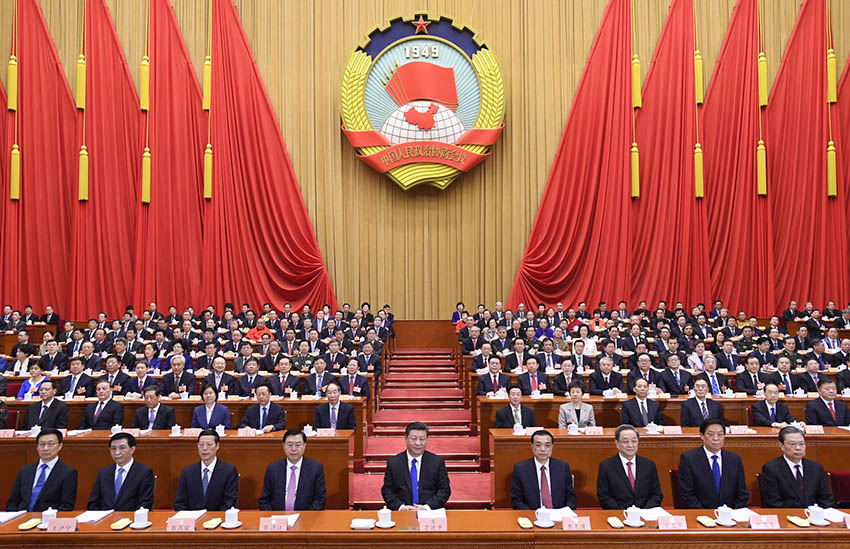 2018年3月3日，中國人民政治協商會議第十三屆全國委員會第一次會議在北京人民大會堂開幕。這是習近平、李克強、張德江、俞正聲、張高麗、栗戰書、王滬寧、趙樂際、韓正在主席台就座。新華社記者 李學仁 攝