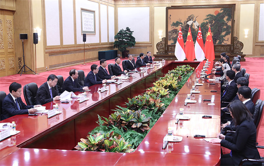 5月14日，國家主席習近平在北京人民大會堂會見來華出席亞洲文明對話大會的新加坡總統哈莉瑪。新華社記者 姚大偉 攝