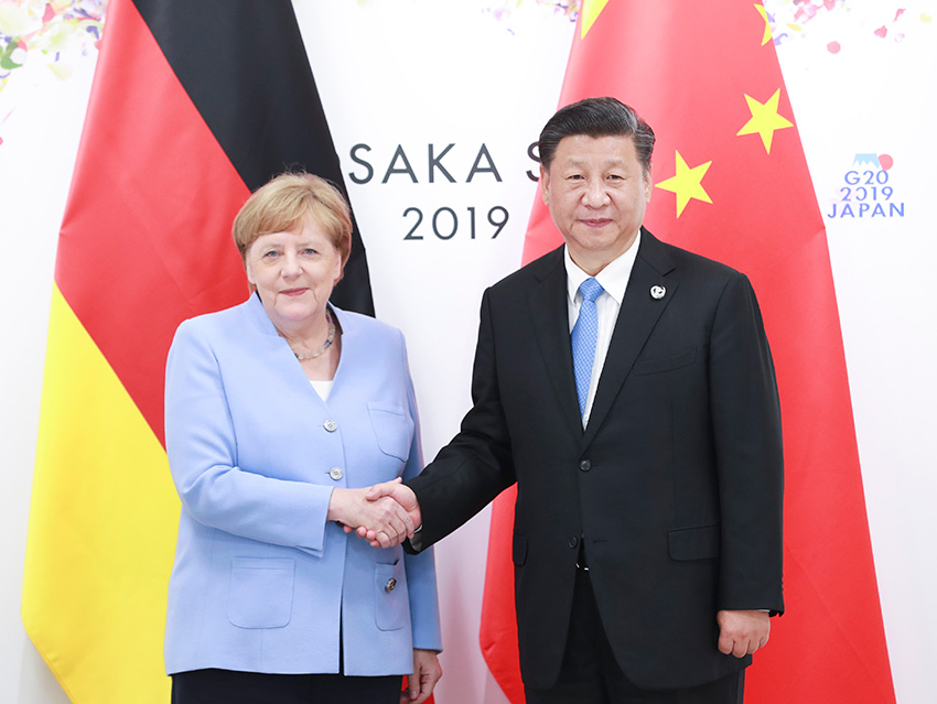 6月28日，國家主席習近平在大阪會見德國總理默克爾。 新華社記者 龐興雷 攝