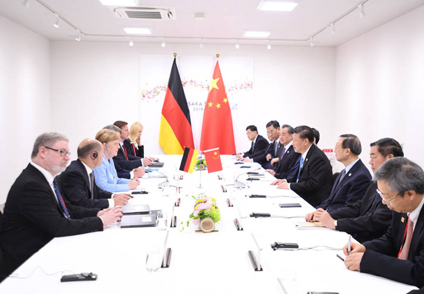 6月28日，國家主席習近平在大阪會見德國總理默克爾。 新華社記者 燕雁 攝